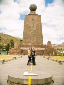 Stephen and Andie on either side of the equator in Ecuador, one of our first adventures in world travel as a couple