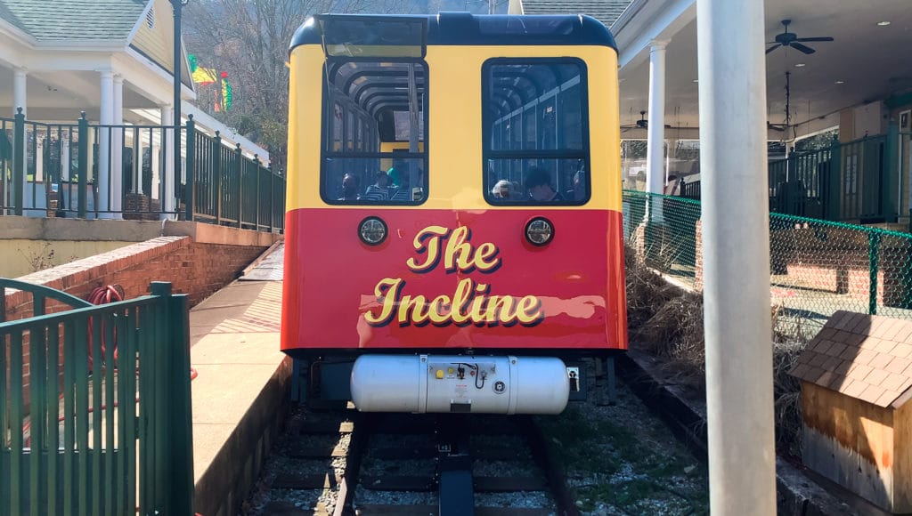 the front of a funicular train car reads "The Incline"