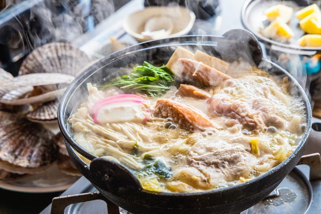 a steaming bowl of nabemono, a Japanese noodle dish