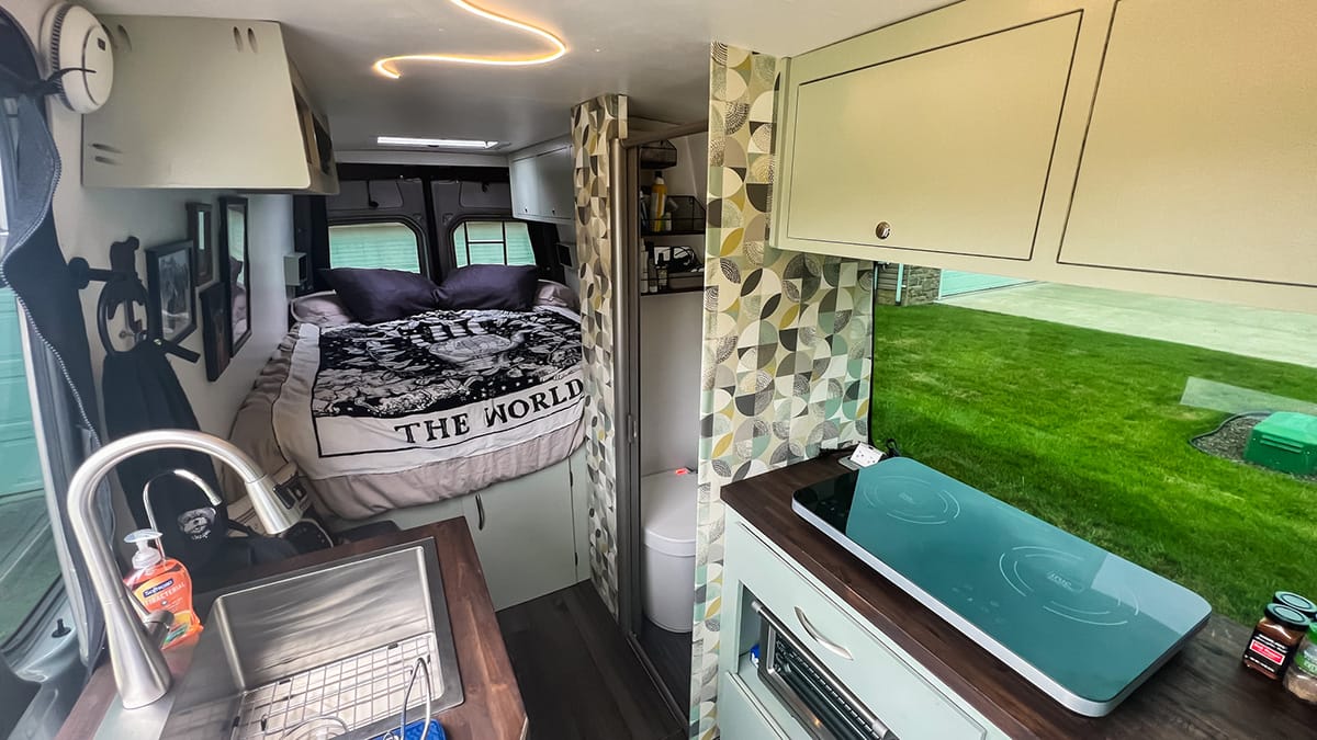 inside of Stephen & Andie's beautifully decorated DIY self-built Sprinter camper van.